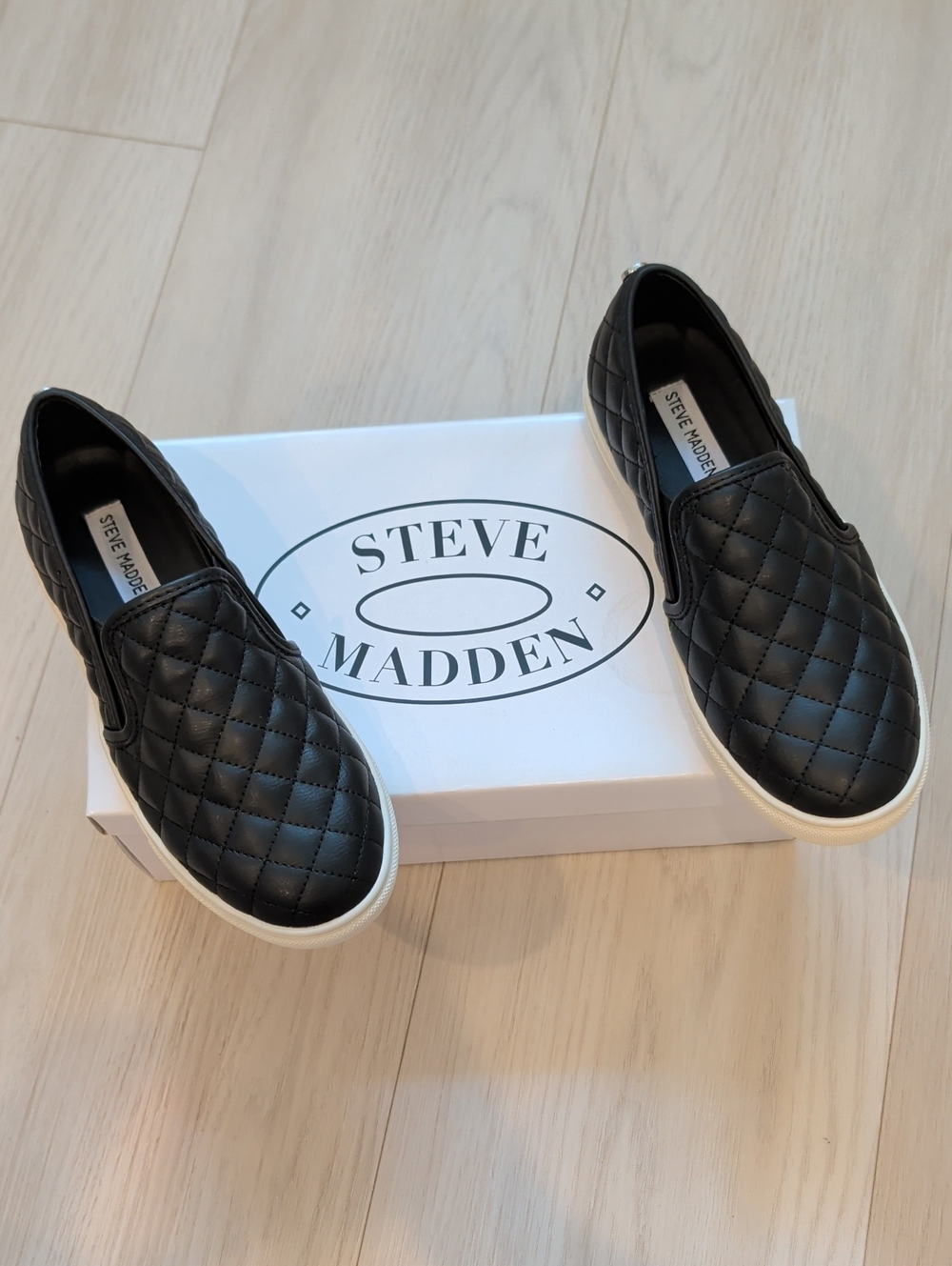 Steve Madden Black Quilted Slip-On Sneakers with White Sole